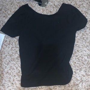 Selling a black crop top with open twos back it is an extra small